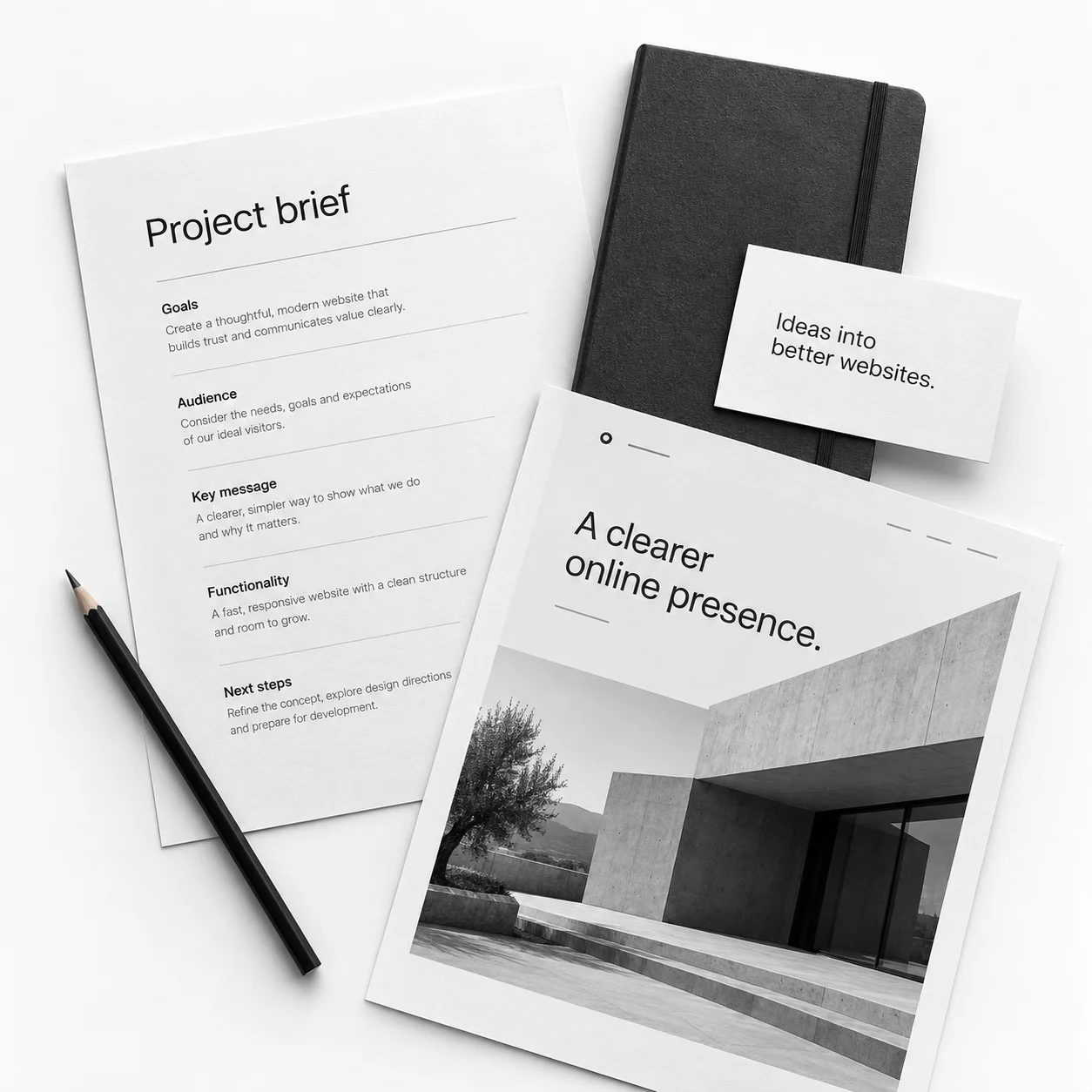 Illustrative project brief, notebook and website layout arranged on a white surface